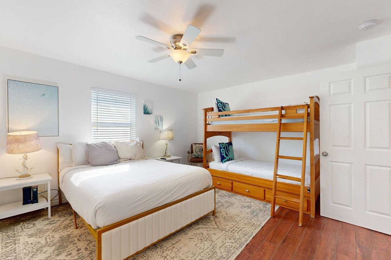 Bunk room with queen bed and twin-over-twin bunk bed